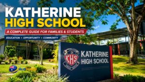 Katherine High School campus in the Northern Territory featuring modern school buildings, landscaped grounds, and the school entrance sign under a bright blue sky.