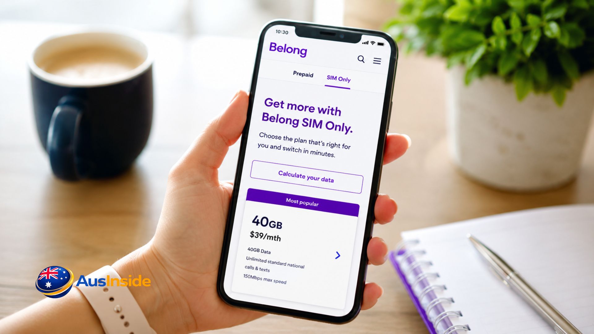 Belong Mobile Plans 2026 displayed on a smartphone beside a Belong SIM card, coffee mug, and notebook on a modern desk in Australia.