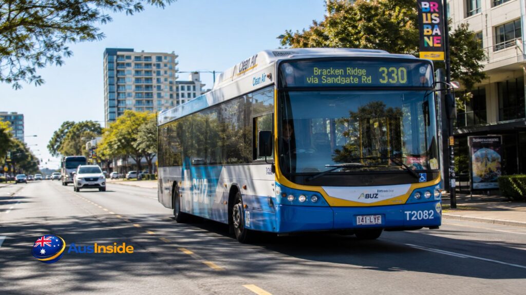 Route 330 Brisbane BUZ bus travelling through a sunny Brisbane street on its way from Bracken Ridge to Brisbane City.