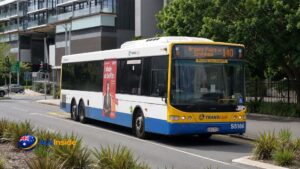Route 140 TransLink bus travelling along a Brisbane city street towards Browns Plains during daytime.